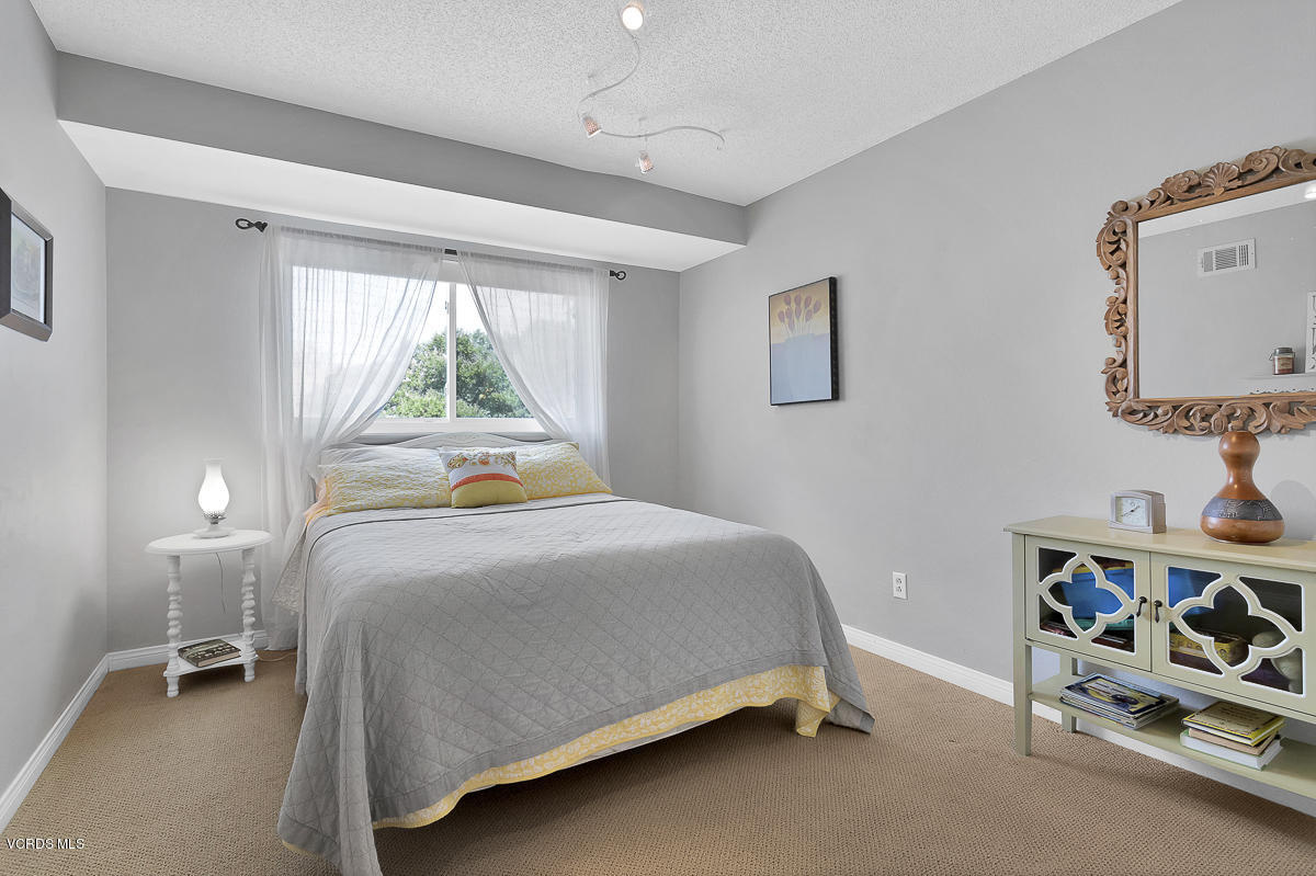 5438 Cochise Street Simi Valley, CA 93063 - Photo 23 of 35 a bedroom with a bed and a window