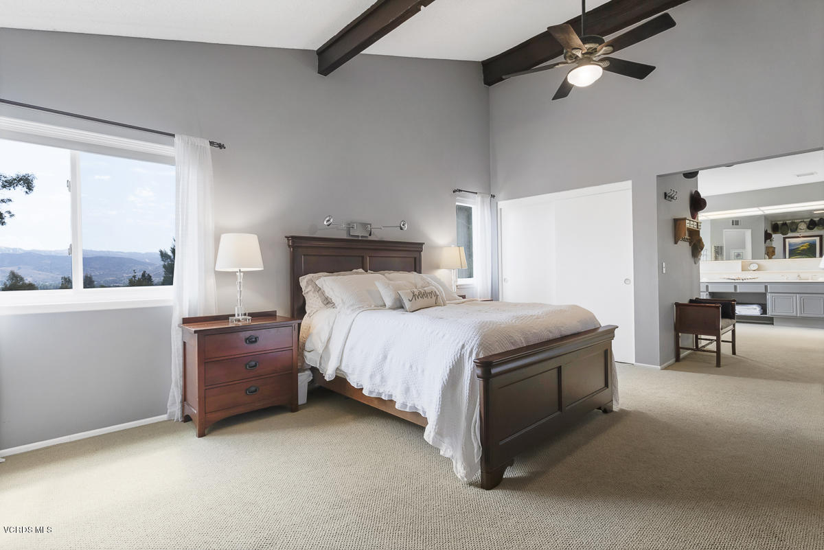 5438 Cochise Street Simi Valley, CA 93063 - Photo 26 of 35 a bed room with a bed and a chair