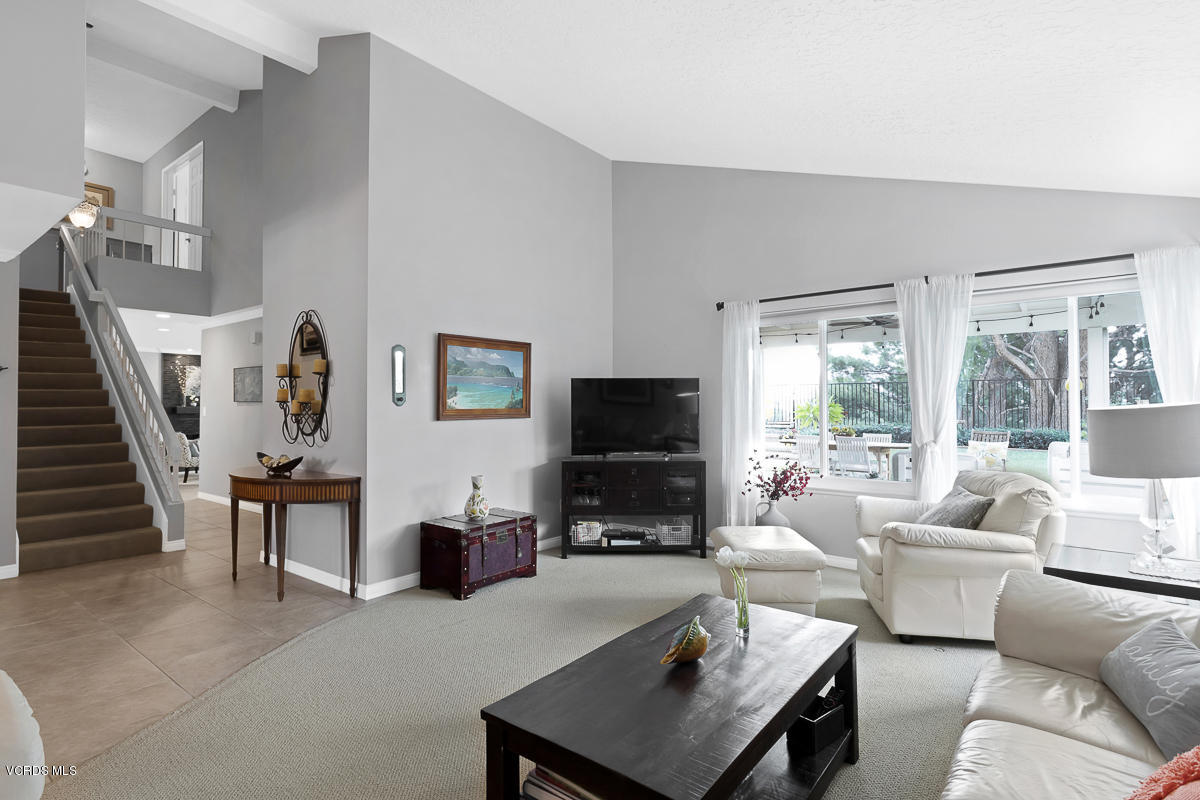 5438 Cochise Street Simi Valley, CA 93063 - Photo 6 of 35 a living room with furniture a flat screen tv and a large window