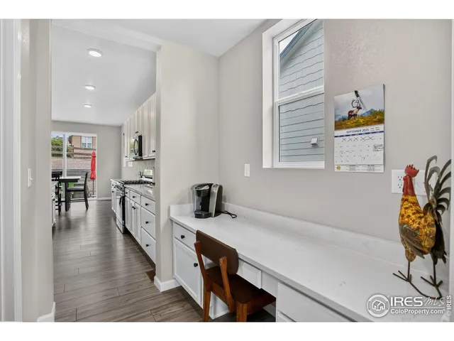 a open kitchen with sink and cabinets
