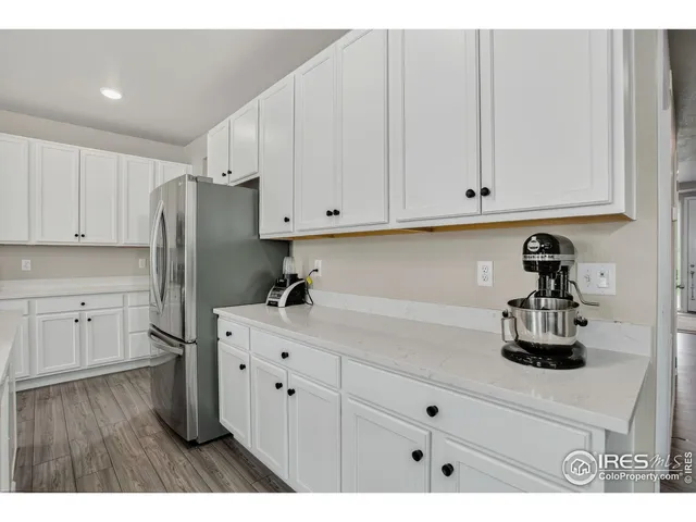 a kitchen with appliances and cabinets