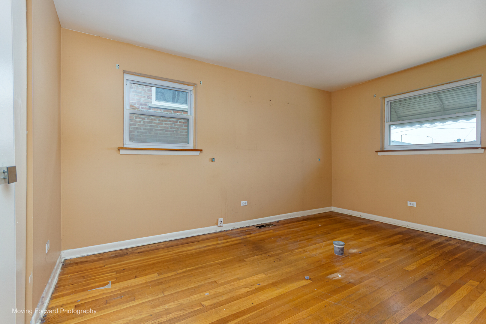 9726 S Lane Chicago, IL 60628 - Photo 15 of 27 a view of a room with wooden floor and window