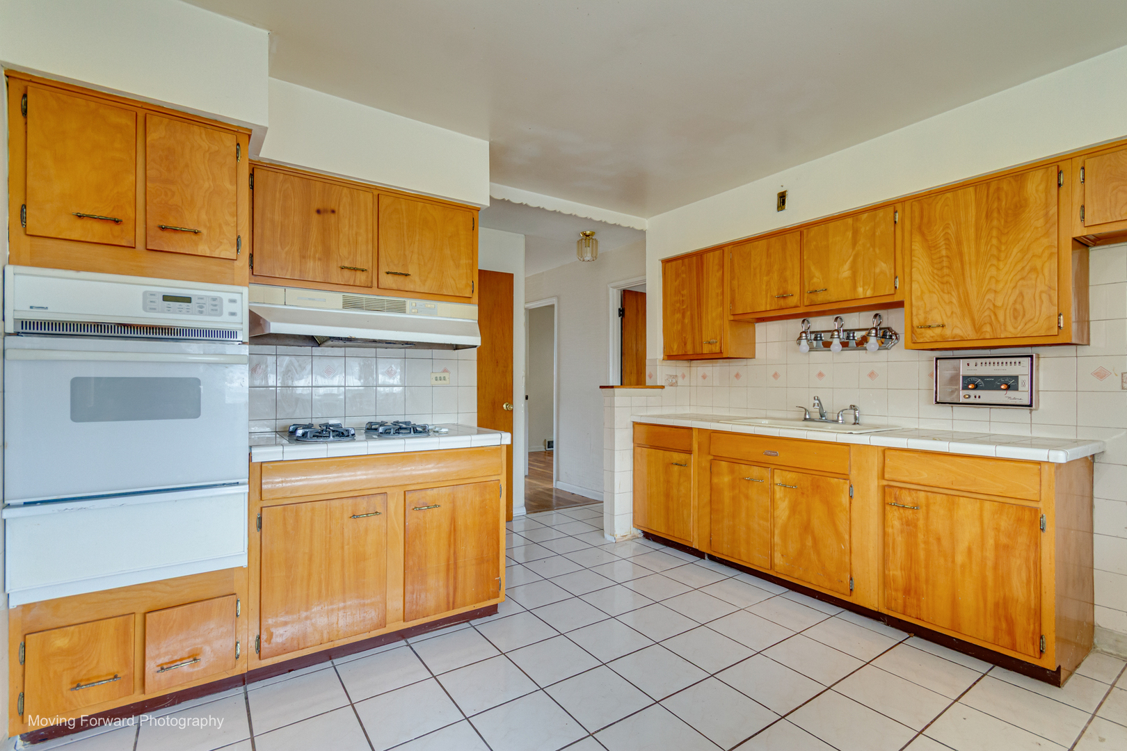 9726 S Lane Chicago, IL 60628 - Photo 18 of 27 a kitchen with stainless steel appliances granite countertop a stove a sink and a refrigerator