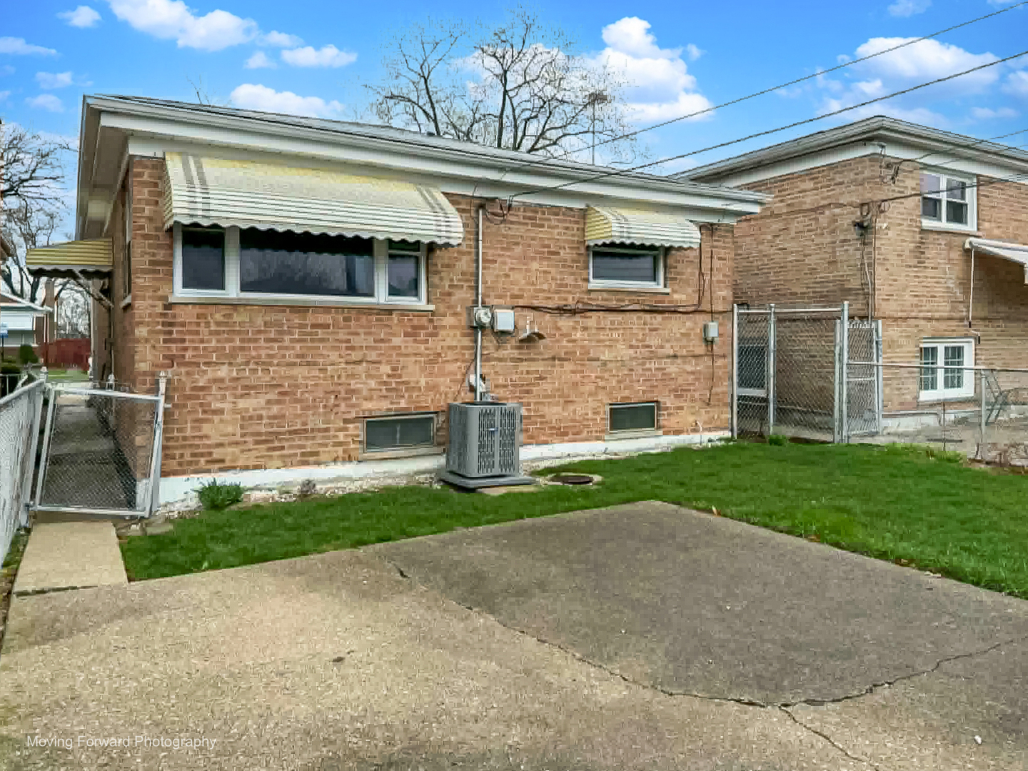 9726 S Lane Chicago, IL 60628 - Photo 7 of 27 a front view of a house with garden