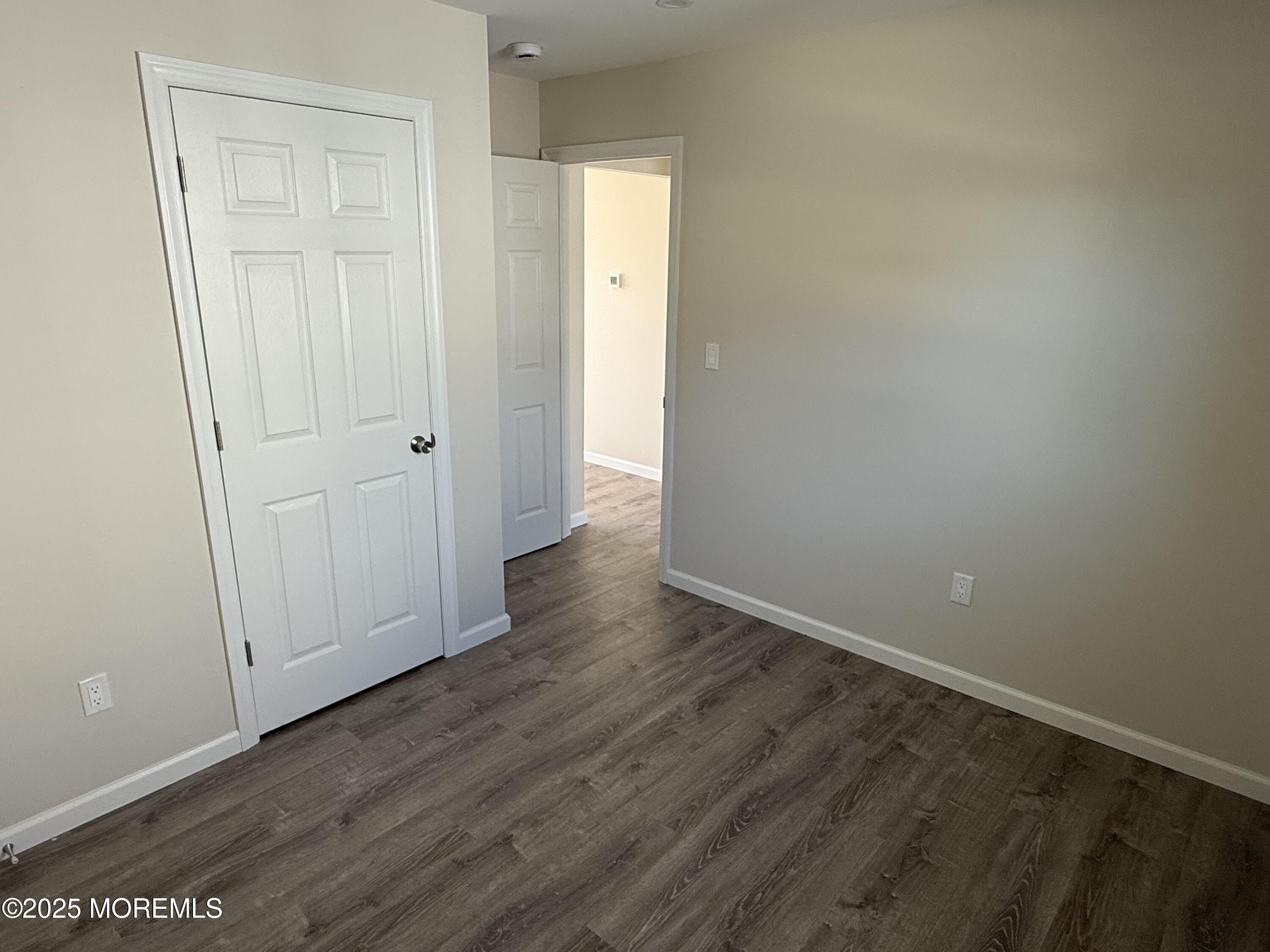 616 Ocean Gate Avenue, Unit 5 Ocean Gate, NJ 08740 - Photo 15 of 15 a view of an empty room with wooden floor