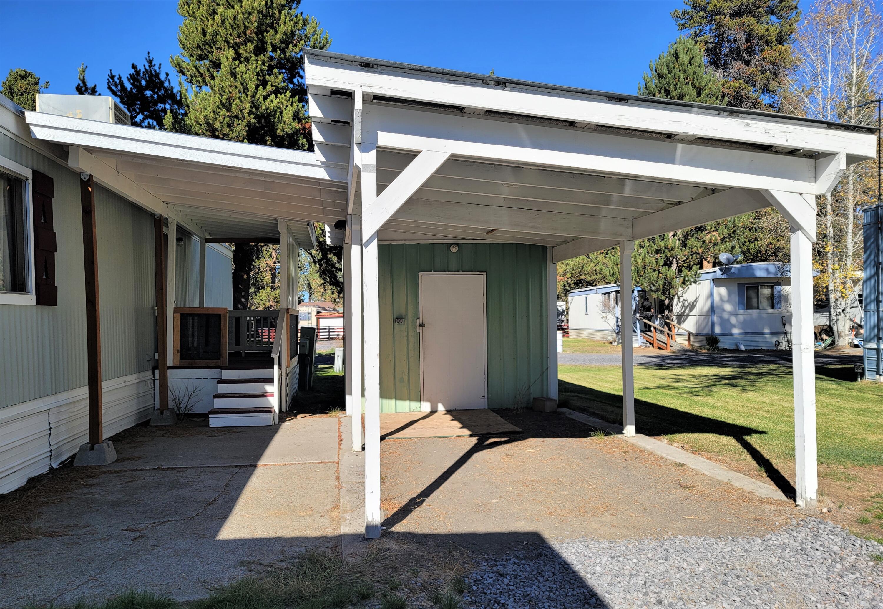 52731 Huntington Road, Unit 29 La Pine, OR 97739 - Photo 2 of 23 Carport with covered walkway to home.