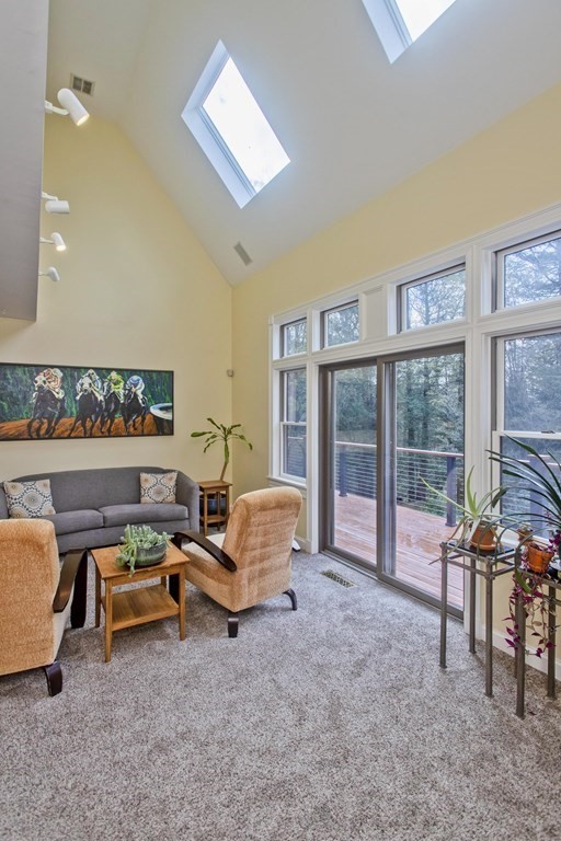 31 Rustlewood Ridge Northampton, MA 01062 - Photo 14 of 42 a living room with furniture and large windows