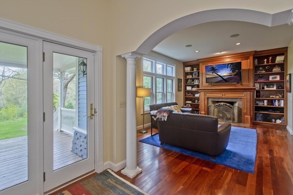 31 Rustlewood Ridge Northampton, MA 01062 - Photo 18 of 42 a living room with furniture a fireplace and a flat screen tv