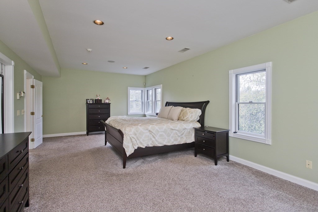 31 Rustlewood Ridge Northampton, MA 01062 - Photo 21 of 42 a spacious bedroom with a bed and a window