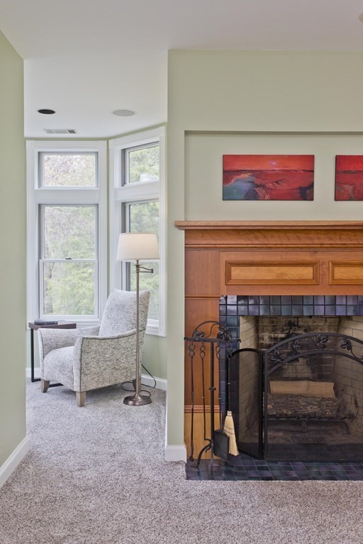 31 Rustlewood Ridge Northampton, MA 01062 - Photo 22 of 42 a living room with furniture a flat screen tv and a table
