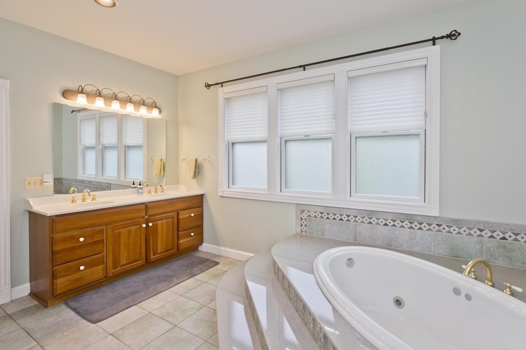 31 Rustlewood Ridge Northampton, MA 01062 - Photo 24 of 42 a spacious bathroom with a tub sink and mirror