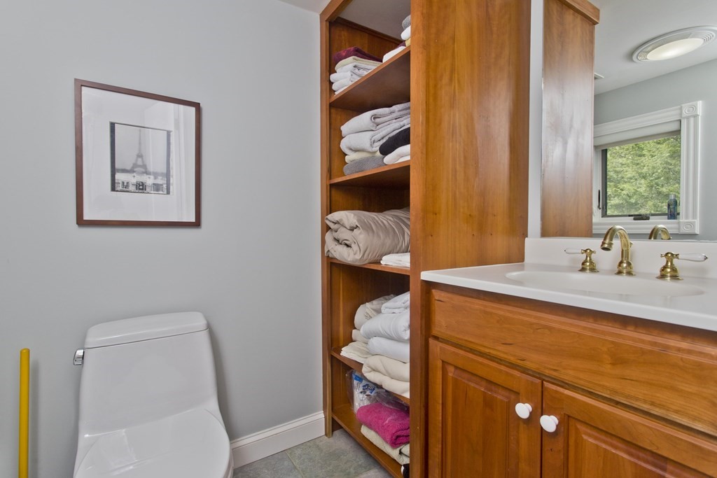 31 Rustlewood Ridge Northampton, MA 01062 - Photo 26 of 42 a en suite bathroom with a granite countertop sink and a mirror