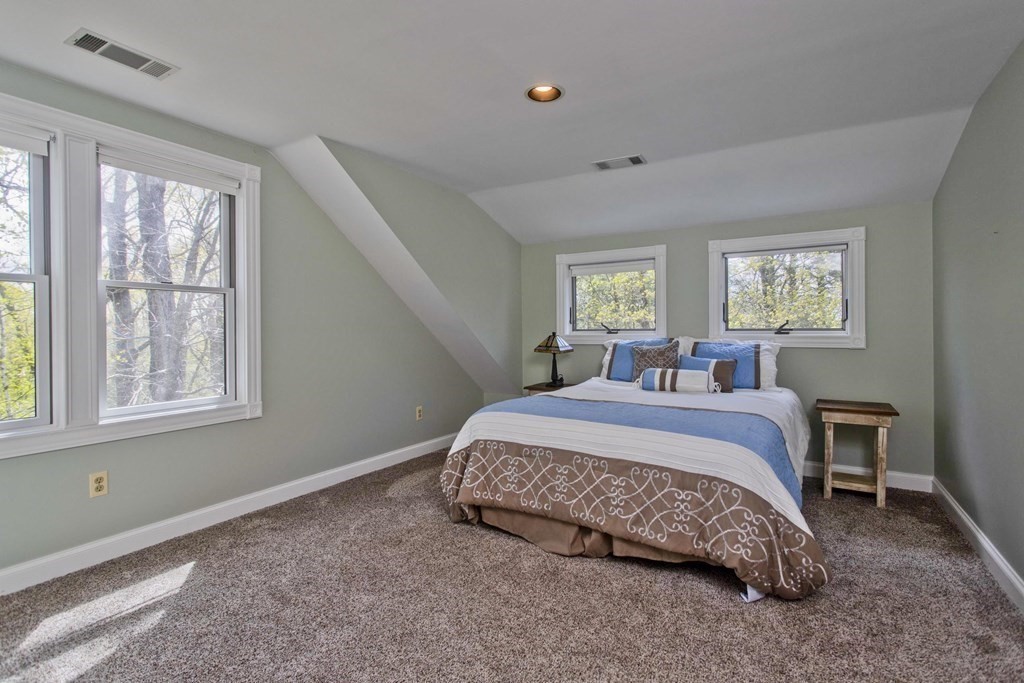 31 Rustlewood Ridge Northampton, MA 01062 - Photo 31 of 42 a spacious bedroom with a bed and window