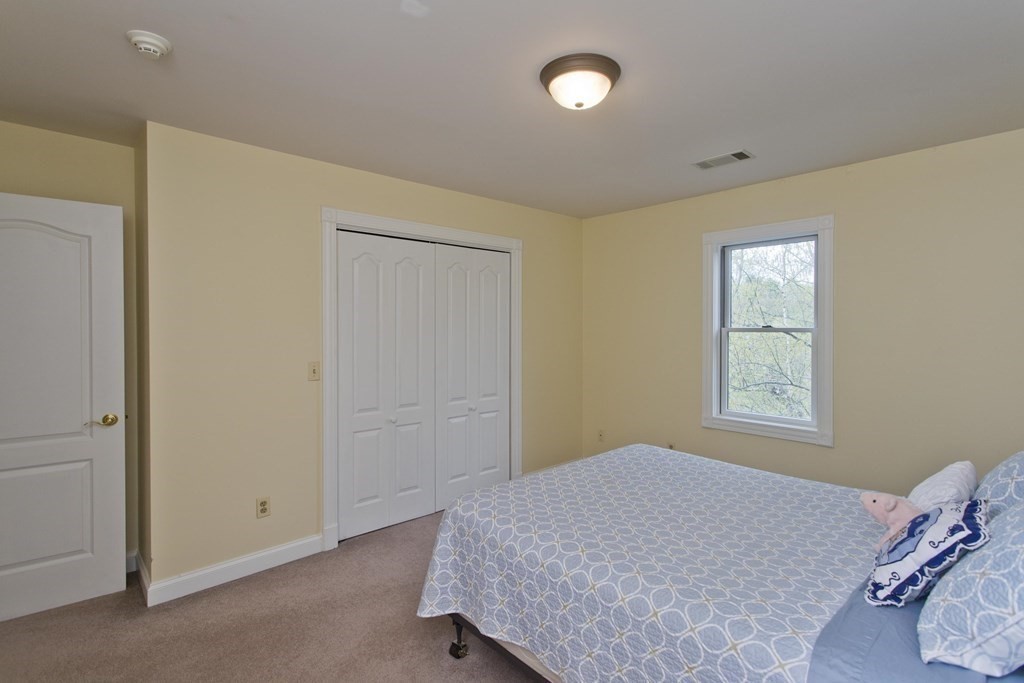 31 Rustlewood Ridge Northampton, MA 01062 - Photo 34 of 42 a bedroom with a bed and a window