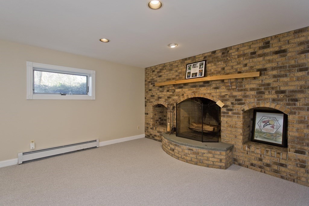 31 Rustlewood Ridge Northampton, MA 01062 - Photo 37 of 42 a living room with furniture and a fireplace