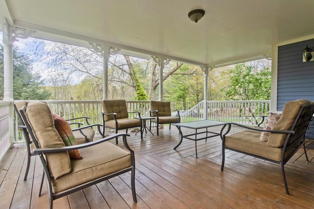 31 Rustlewood Ridge Northampton, MA 01062 - Photo 6 of 42 a living room with furniture and a floor to ceiling window