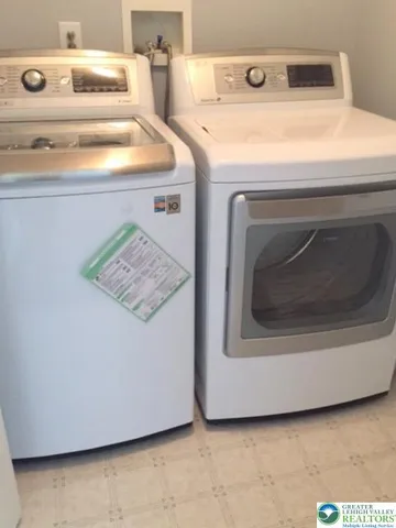 a utility room with washer and dryer