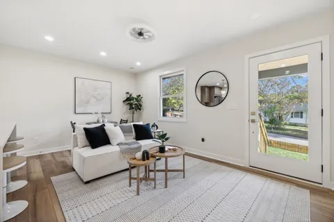 a living room with furniture and a window