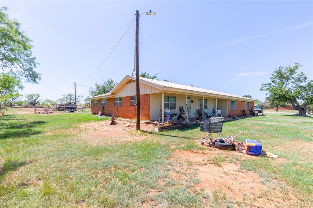 6702 West Lake Road Abilene, TX 79601 - Photo 5 of 21 a view of a house with backyard and sitting area