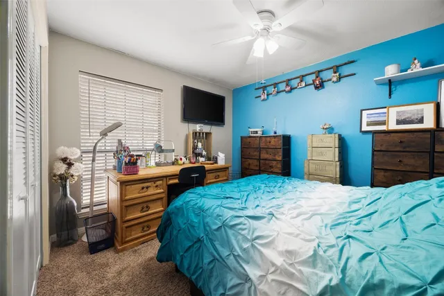 a bathroom with a toilet a sink and a mirror