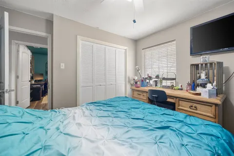 a bedroom with a bed and furniture