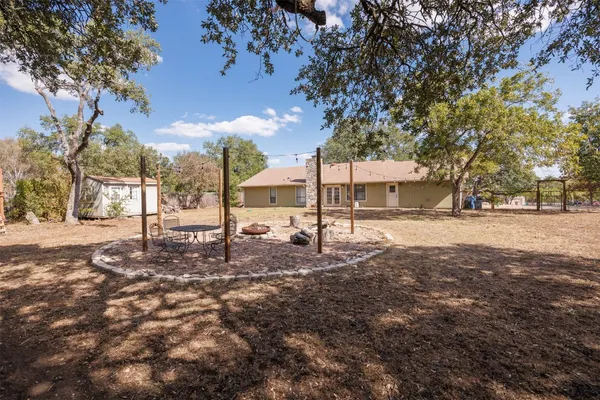 a backyard of a house with lots of green space