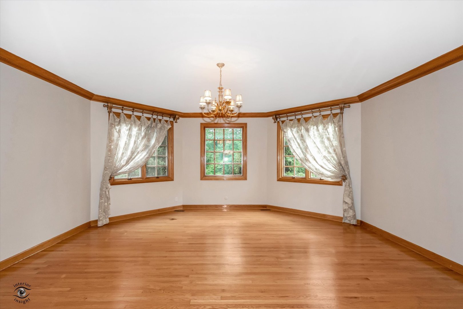 20841 Wolf Road Mokena, IL 60448 - Photo 17 of 40 a view of an empty room with wooden floor and a window