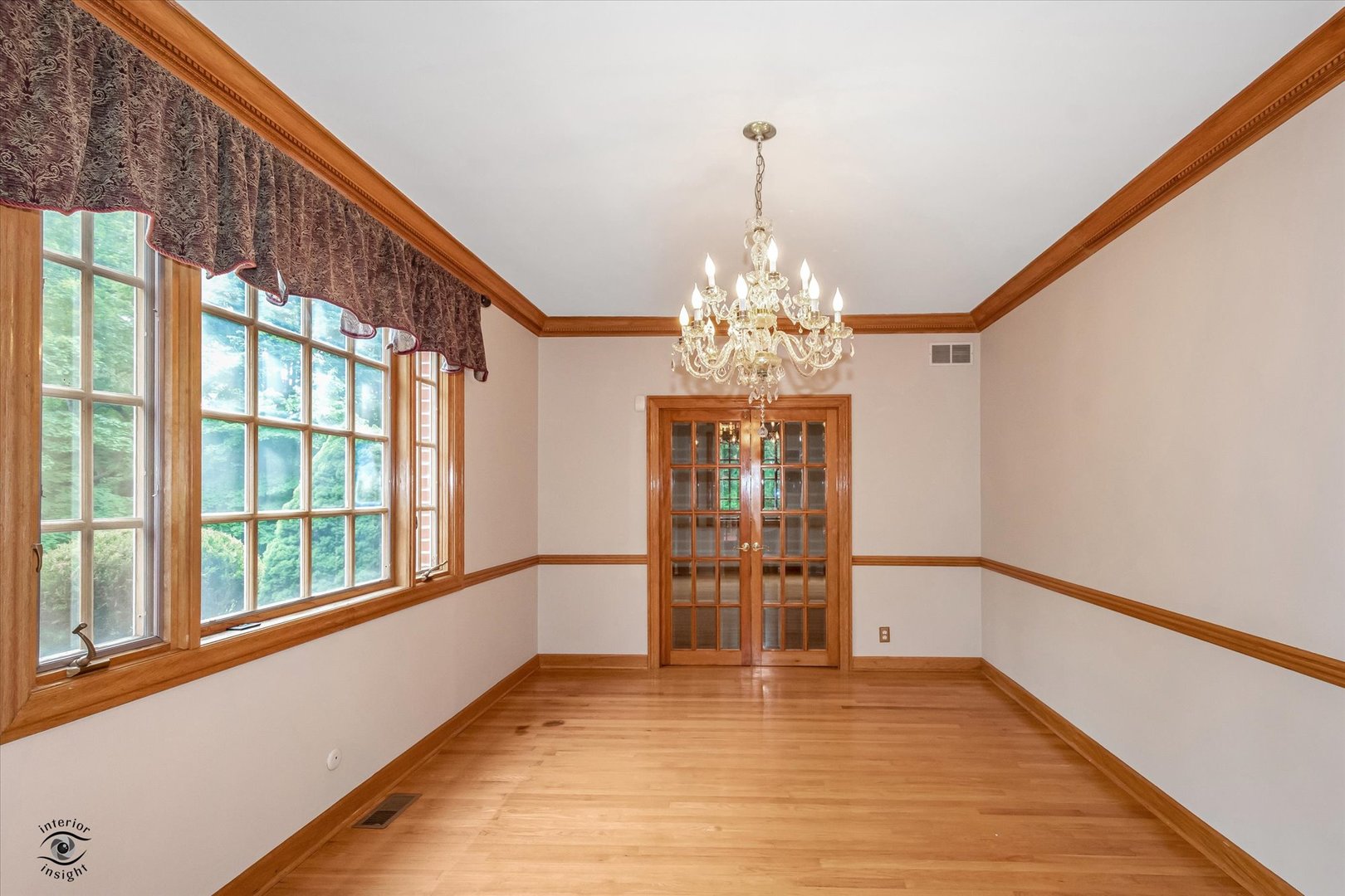 20841 Wolf Road Mokena, IL 60448 - Photo 19 of 40 a view of a room with wooden floor chandelier and windows