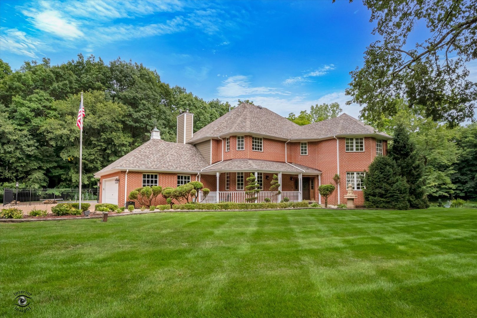 20841 Wolf Road Mokena, IL 60448 - Photo 2 of 40 a white house with a big yard and potted plants in front of the house