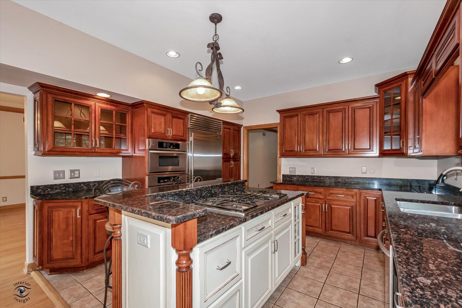 20841 Wolf Road Mokena, IL 60448 - Photo 22 of 40 a kitchen with stainless steel appliances granite countertop a stove and a sink