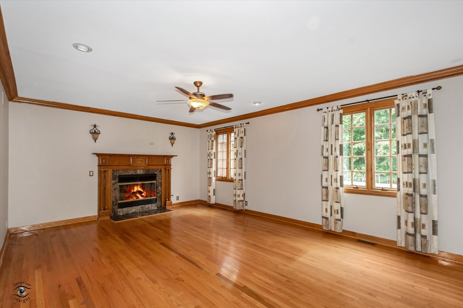 20841 Wolf Road Mokena, IL 60448 - Photo 24 of 40 an empty room with wooden floor fireplace and windows