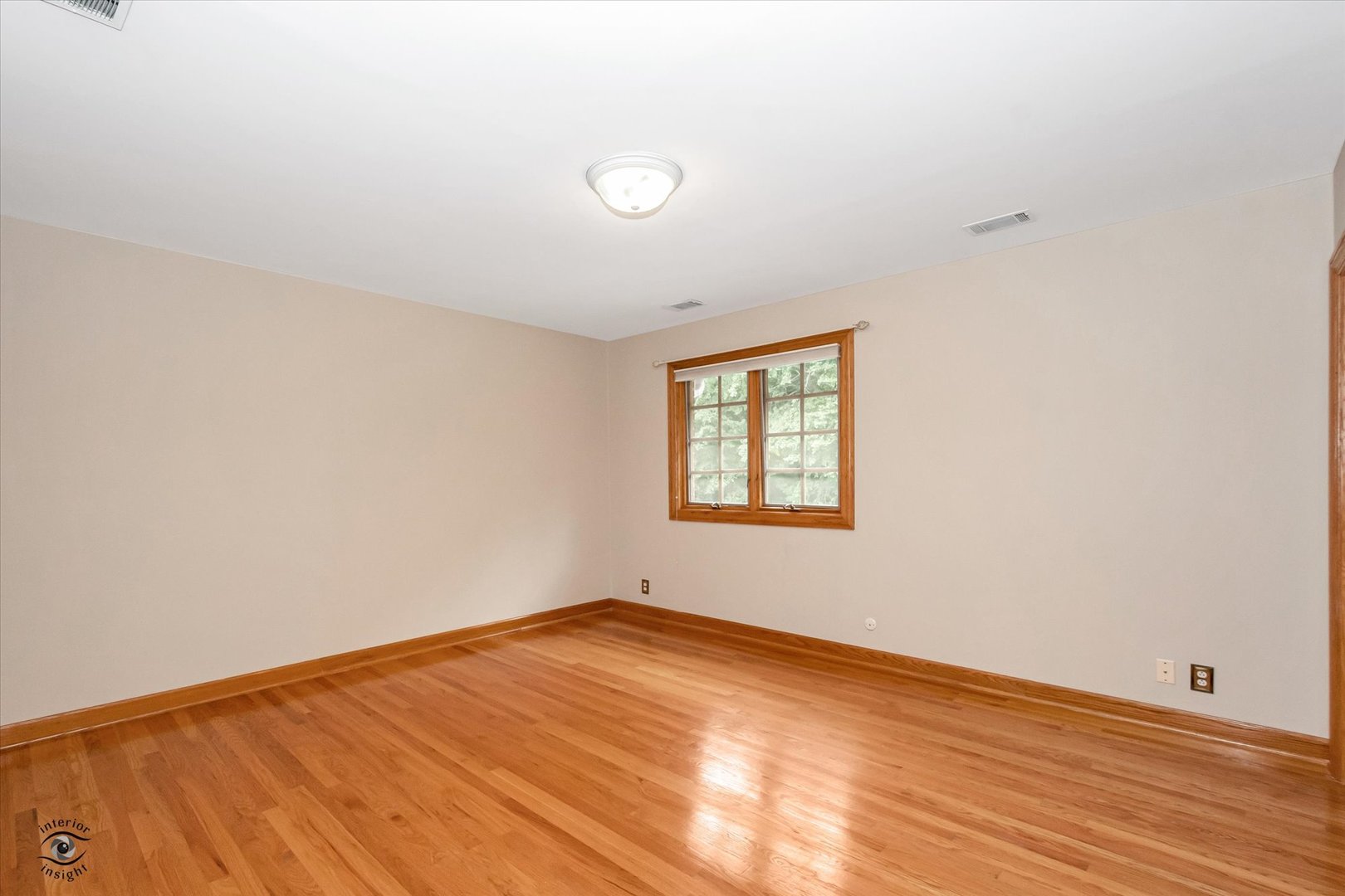 20841 Wolf Road Mokena, IL 60448 - Photo 35 of 40 an empty room with wooden floor and windows