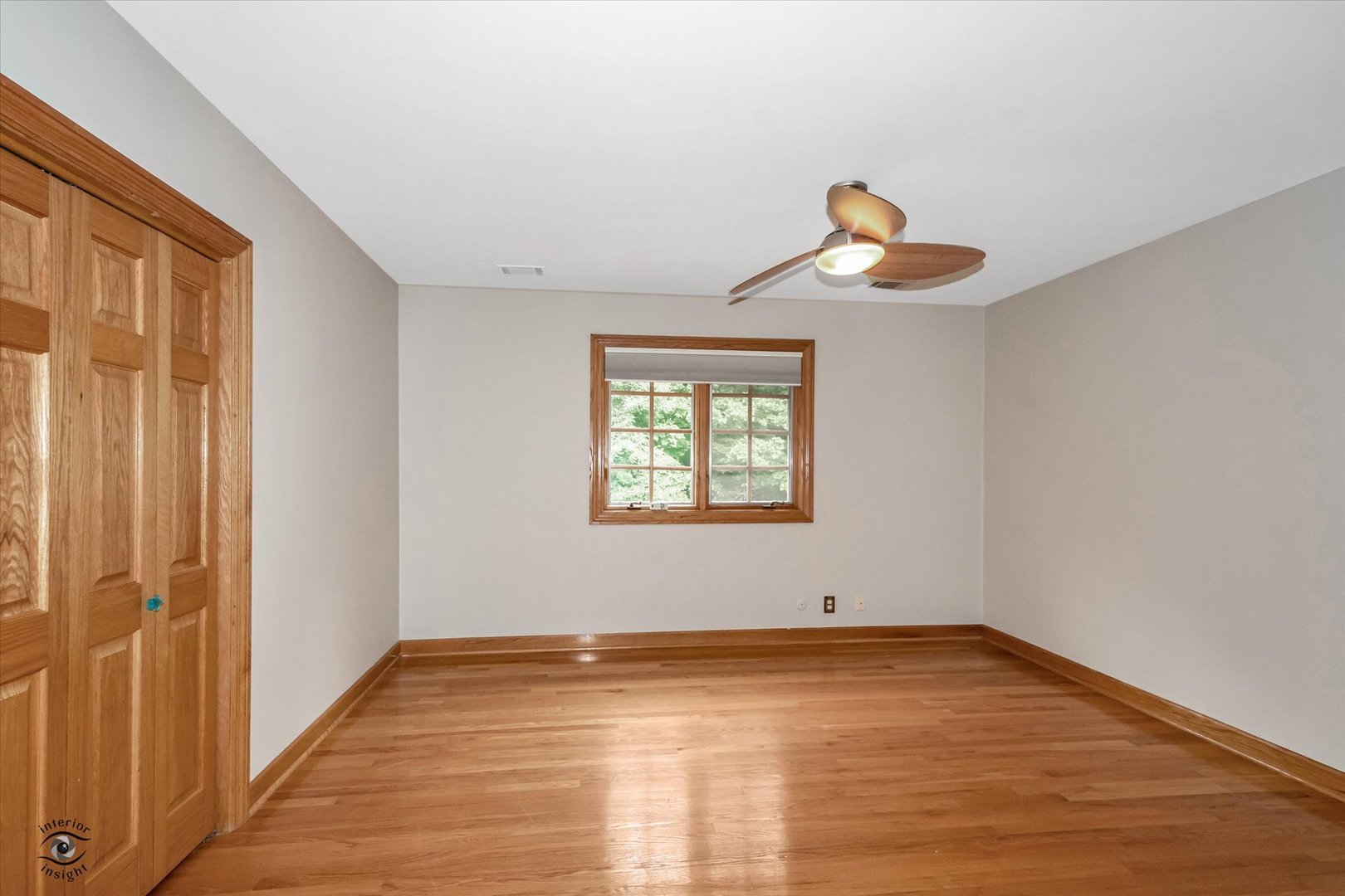 20841 Wolf Road Mokena, IL 60448 - Photo 36 of 40 a view of empty room with wooden floor and fan