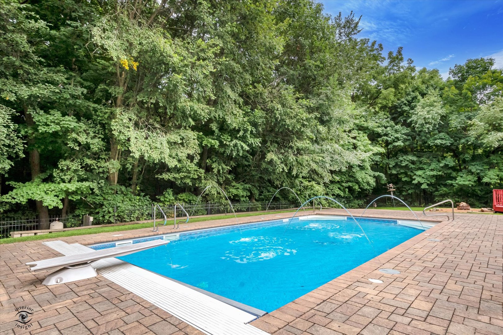 20841 Wolf Road Mokena, IL 60448 - Photo 6 of 40 a view of a swimming pool and trees in the background
