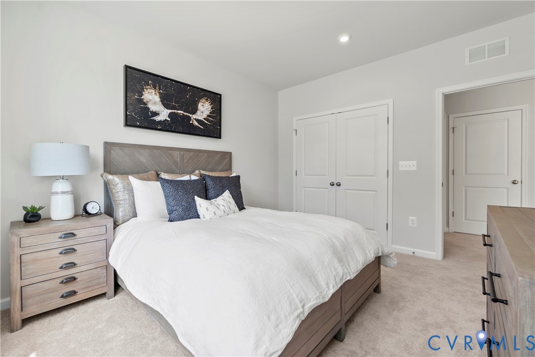 3609 Edna Path, Unit A Richmond, VA 23233 - Photo 19 of 26 a bedroom with a bed and a lamp on dresser
