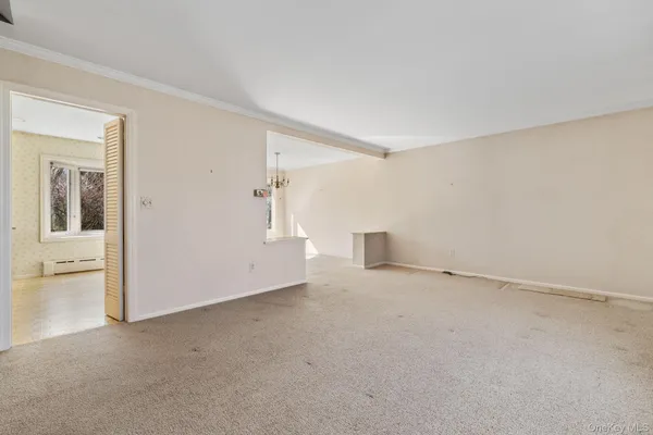 an empty room with a empty space and window
