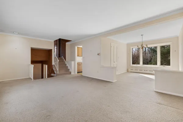 a view of a room with window wooden floor and windows