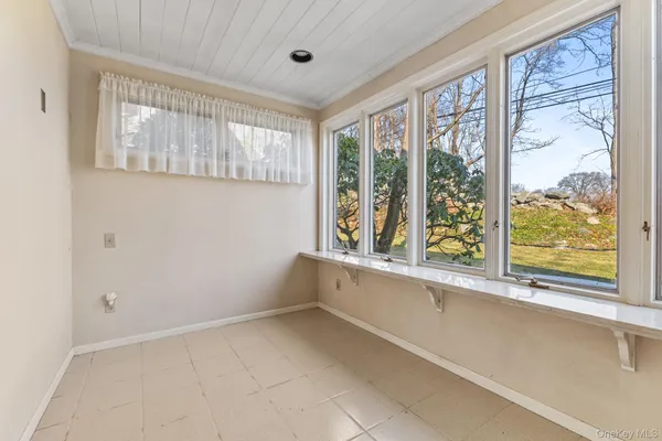 a view of a kitchen with a large window
