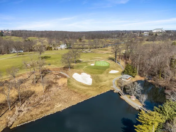 a view of a lake with a yard