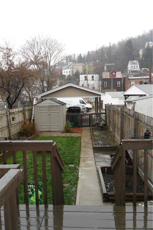 539 Evergreen Road Millvale, PA 15209 - Photo 4 of 11 Back deck leads to large rear fenced yard for entertaining.