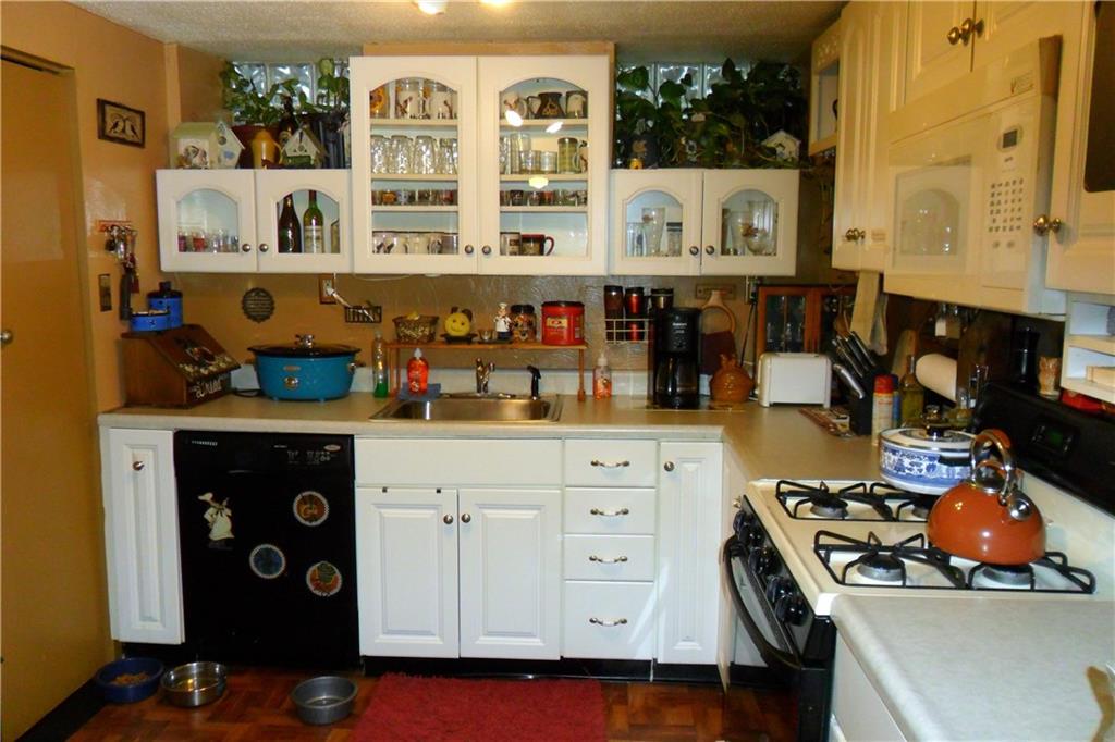 539 Evergreen Road Millvale, PA 15209 - Photo 6 of 11 Updated white kitchen comes with all appliances including newer dishwasher.