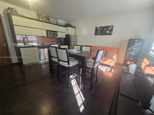 a view of a livingroom with furniture and wooden floor