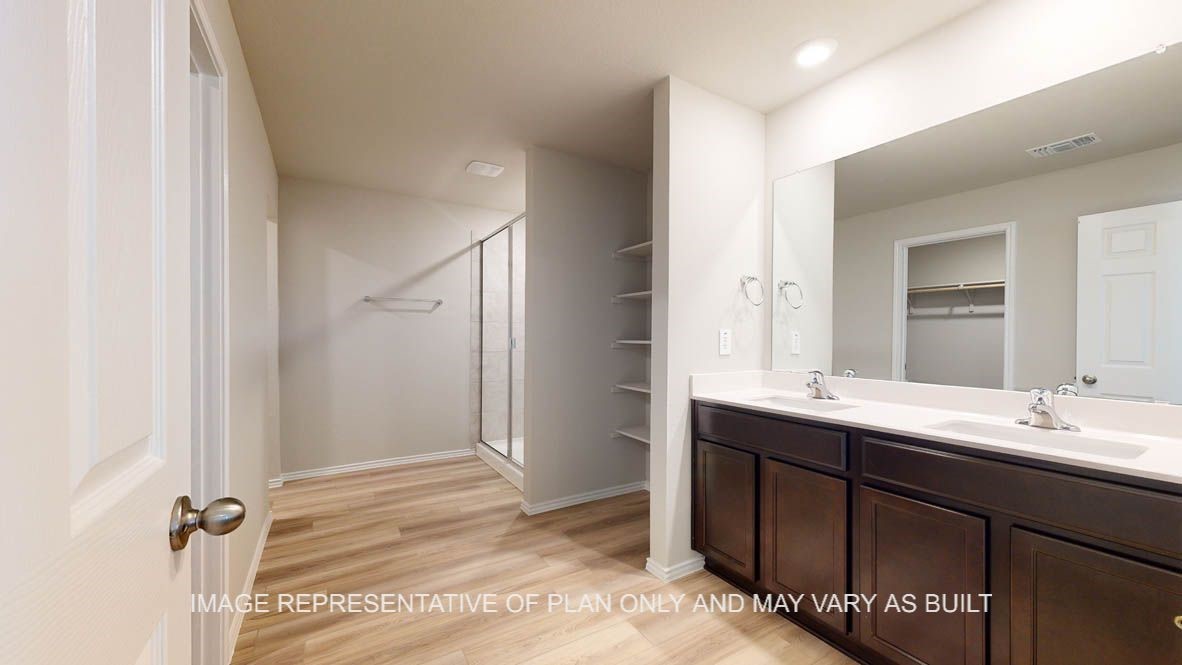 3016 Taddy Road Lorena, TX 76655 - Photo 15 of 29 a bathroom with a double vanity sink a mirror and a shower