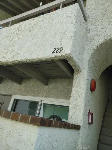 a living room with furniture a couch and a flat screen tv