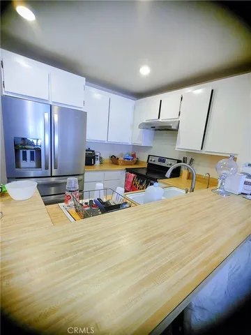 a room with furniture and a wooden floor