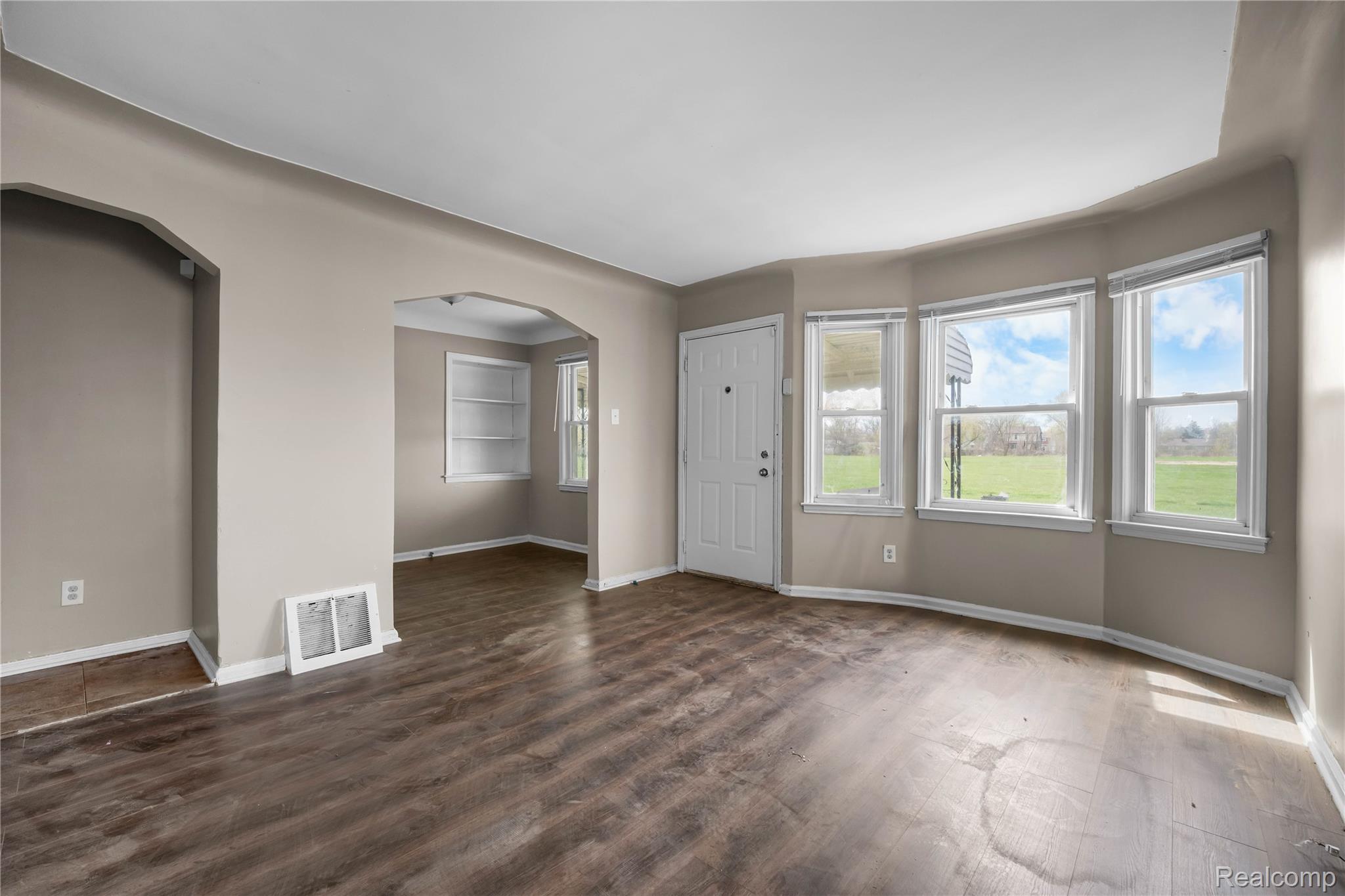 4049 Williams Street Inkster, MI 48141 - Photo 6 of 21 Entryway with arched walkways and dark wood finished floors