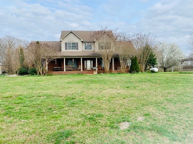 14 North George Road Flintville, TN 37335 - Photo 2 of 48 a view of a house with a big yard and large trees