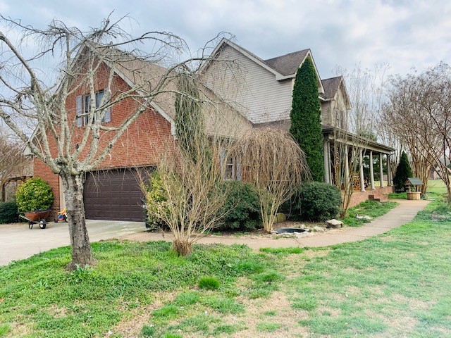 14 North George Road Flintville, TN 37335 - Photo 3 of 48 a view of a house with a yard and plants