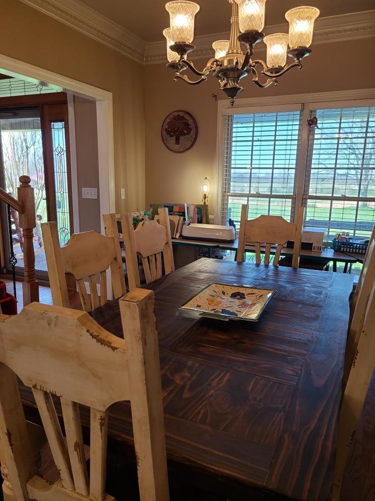 14 North George Road Flintville, TN 37335 - Photo 23 of 48 a view of a dining room with furniture a chandelier and large windows