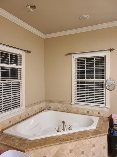 14 North George Road Flintville, TN 37335 - Photo 24 of 48 a bath tub sitting in a bathroom next to a window
